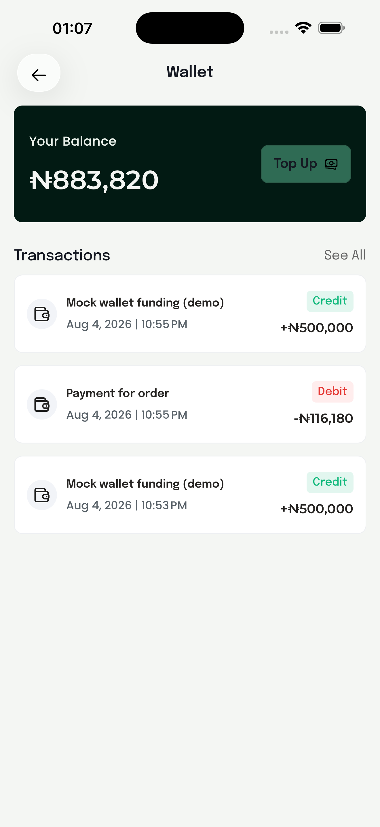 The customer wallet: current balance in Naira, a Top Up button and the transaction history below.